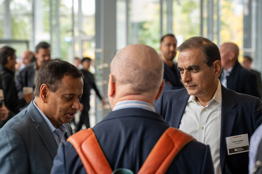Presenter Bimal Kadikar of Transcend talking with attendees during the reception