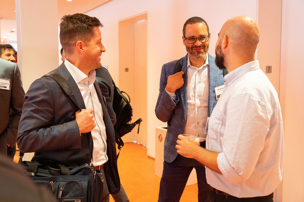 Attendees talking during the networking reception
